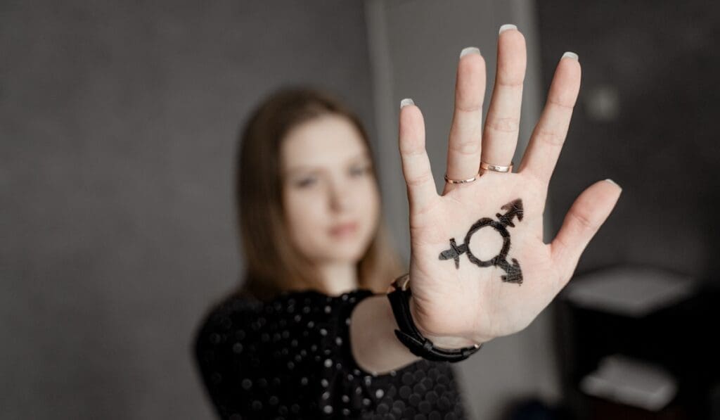 Girl Shows On Her Hand The Combined Symbol Of 2025 03 23 18 50 33 Utc